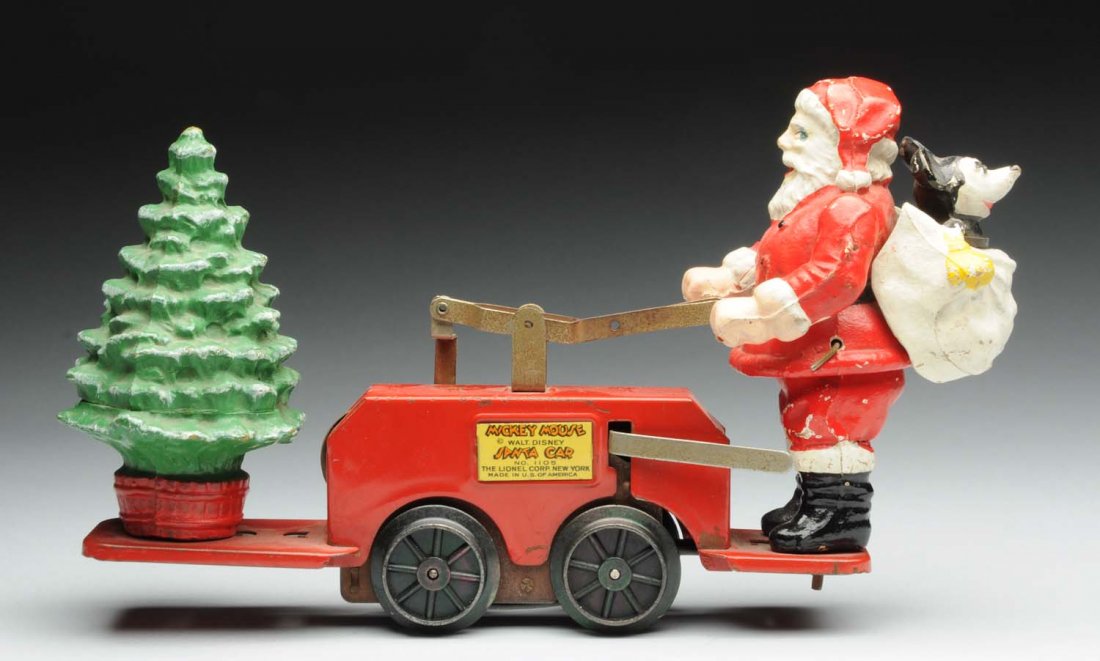 Lionel Walt Disney Mickey Mouse & Santa Claus Toy: Composition Santa Claus with Mickey Mouse in back present pack. Also has composition tree on front. Marked "No. 1105 Lionel Corp. New York." Some chipping and wear to figures, with some minor to moder