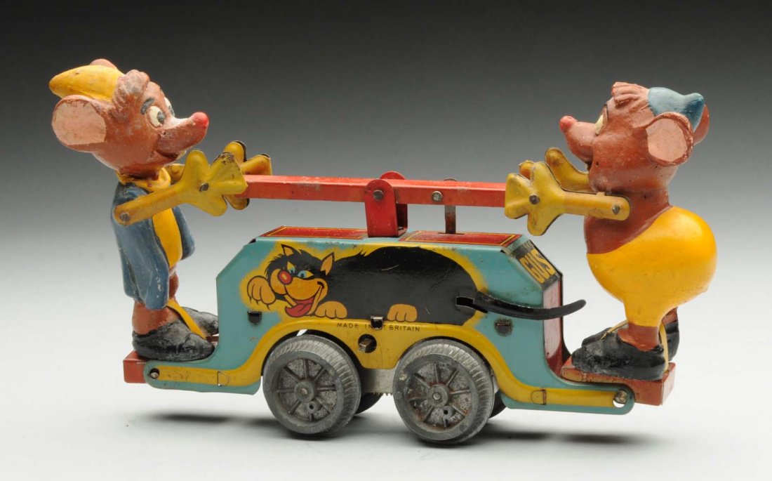Wells Gus & Jaq Tin Litho Wind-Up Handcar Toy.: Marked "Made in Great Britain." Composition figures with tin litho base. One of the harder handcars to find from the series. Some wear to figures, and minor scratching to base. Condition (Very Good). 