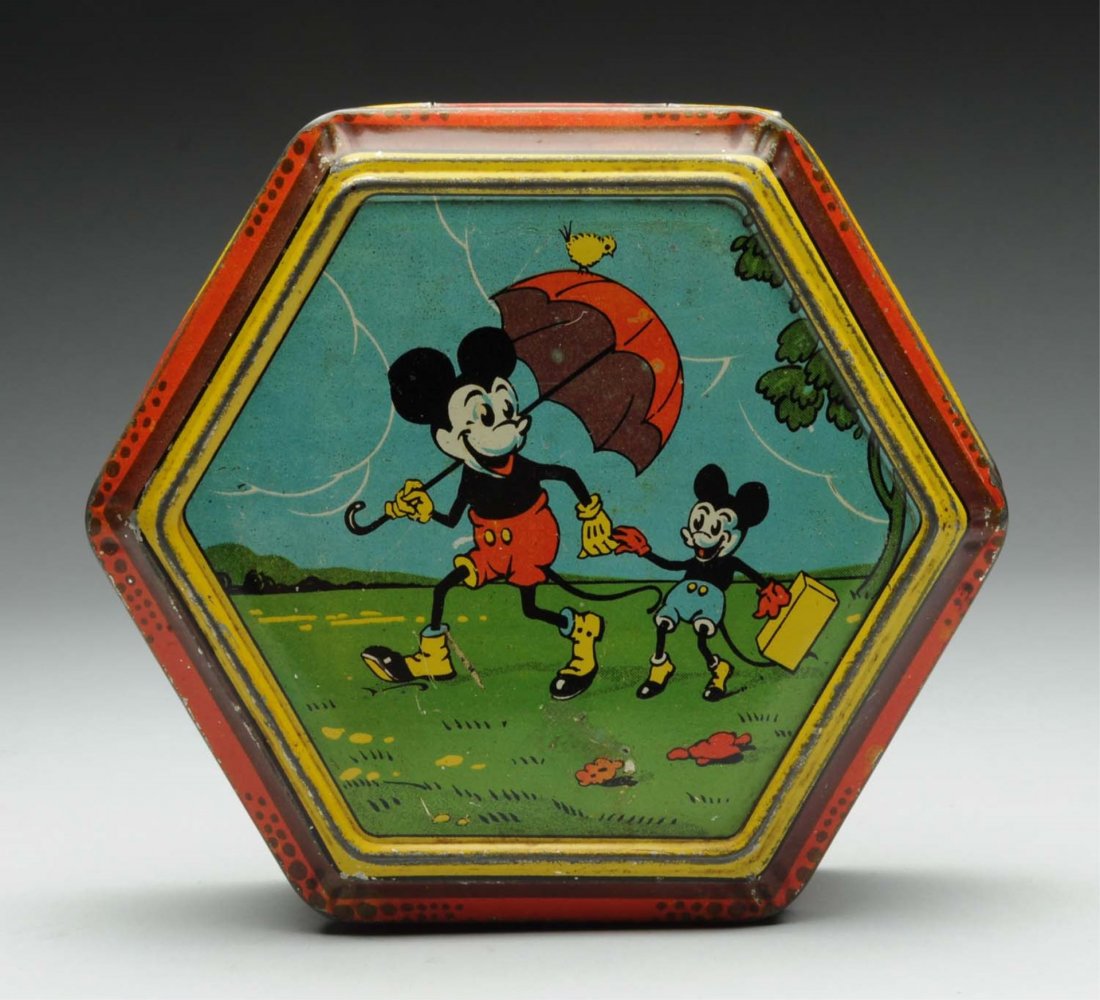 Disney Hexagonal Belgium Tin with Hinged Lid: Circa 1930s, Belgium. Colorful but probably unlicensed tin shows Mickey Mouse and his nephew on lid, also depicts Mickey in a number of unlikely sports activates including roller skating, falling from