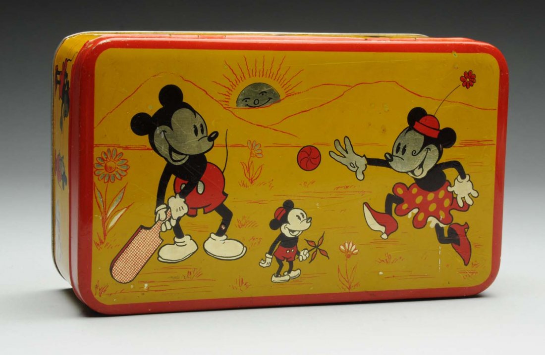 Disney Mickey Mouse Tin Box.: Rectangular swiss tin box with hinged lid. Circa 1930s, Hoffman, Switzerland. Unusual graphics on lid features Minnie, Mickey and his nephew playing Cricket, sides show them fishing and walking Pluto.