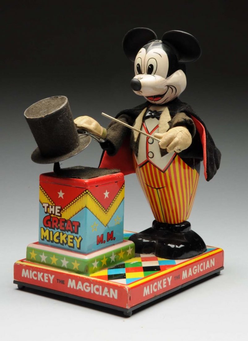 Japanese Walt Disney Mickey Mouse the Magician.: Tin litho battery operated toy. Includes original ears, hands, and nose.. Hands have some cracking, and one small piece of wrist is missing on the left arm. Looks to have a replacement chick. Toy work