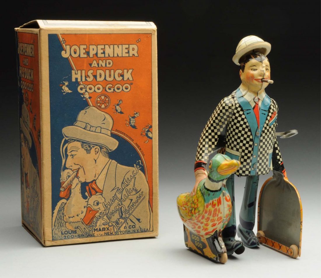 Marx Tin Litho Wind-Up Joe Penner Toy.: Includes very colorful original box. Box marked "Joe Penner and His Duck Goo-Goo" and "Wanna Buy a Duck?" Toy has original hat, and nice bright tin litho. Some minor scratching and wear thoughout toy,