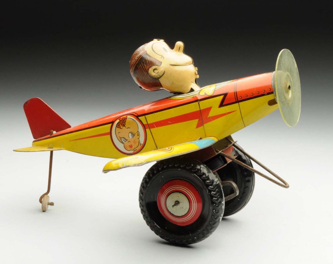 Marx Tin Litho Wind-Up Dagwood Airplane Toy.: Includes original head, propeller and tail fin. Marked "King Features Syndicate, Copyright 1930." Nice lithographed characters on all sides of the plane. Some scratching. Condition (Very Good - Excell