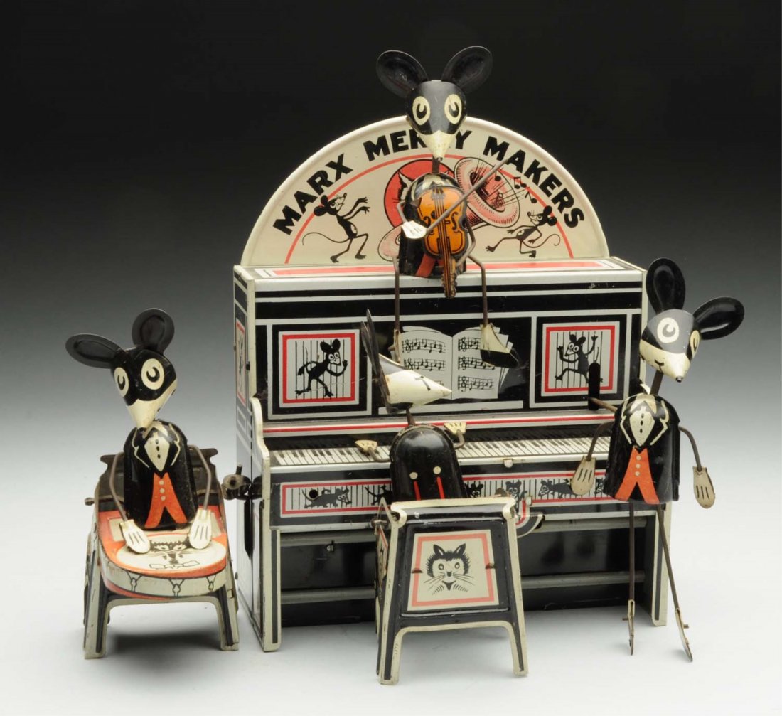 Marx Tin Litho Wind-Up Merrymakers Band.: Scarcer version with marquee back piece. Nice lithography. Beautiful action toy. Very popular. Also has a violin player. Minor scratching and wear to front and back of the piano, and where the mouse h