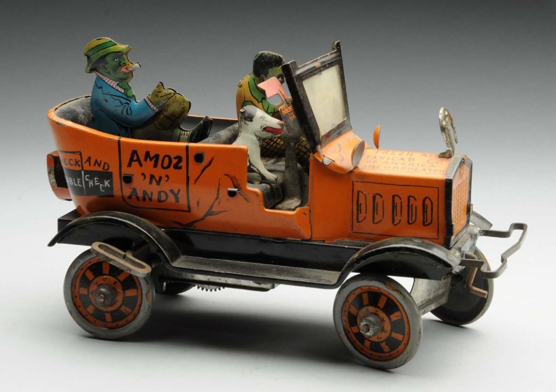 Marx Tin Litho Wind-Up Amos & Andy Taxi Cab Toy.: All original, including horseshoe in front and hand crank below grille. Some scratching and edge wear to figures and car. Condition (Very Good - Excellent). Size 8" L.