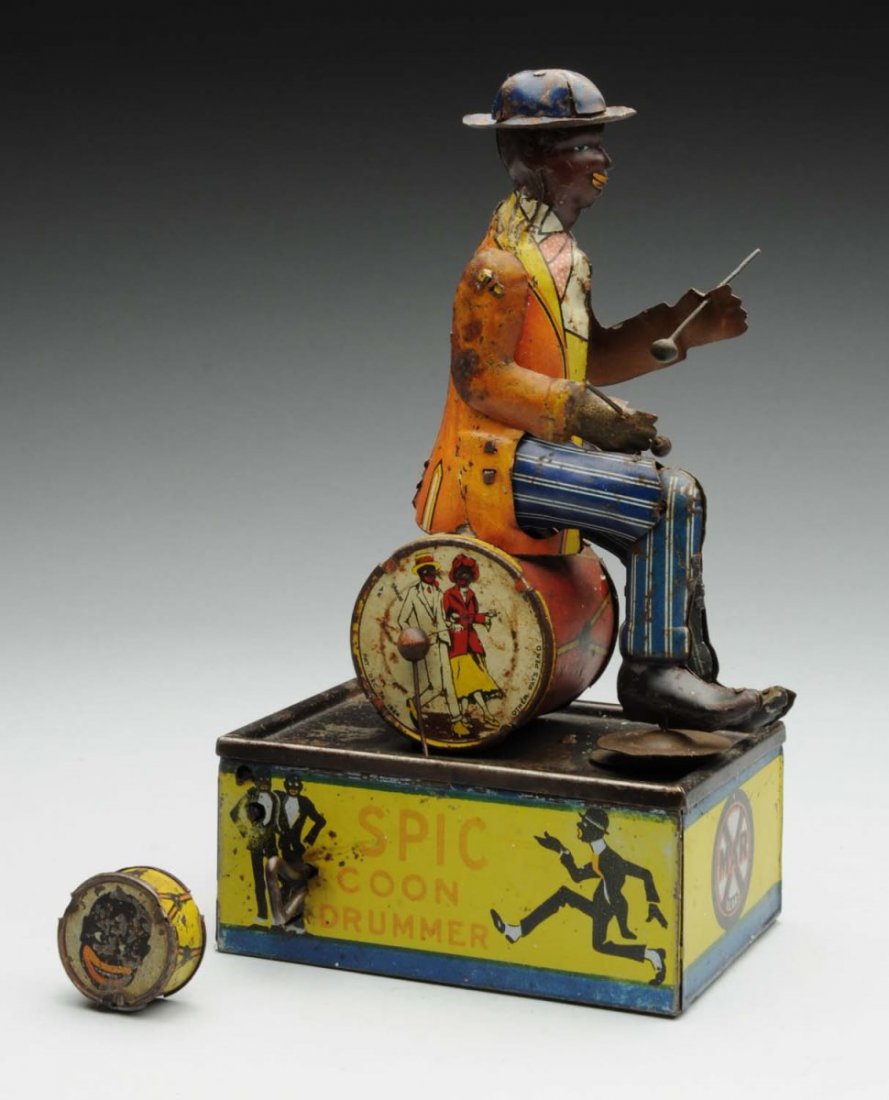 Marx Tin Litho Wind-Up Spic Drummer Toy.: Looks to be all original, including sticks and drum head. Some moderate to heavy scratching and litho loss. Drum head needs to be reattached. Condition (Good - Very Good). Size 8 - 3/4" T.