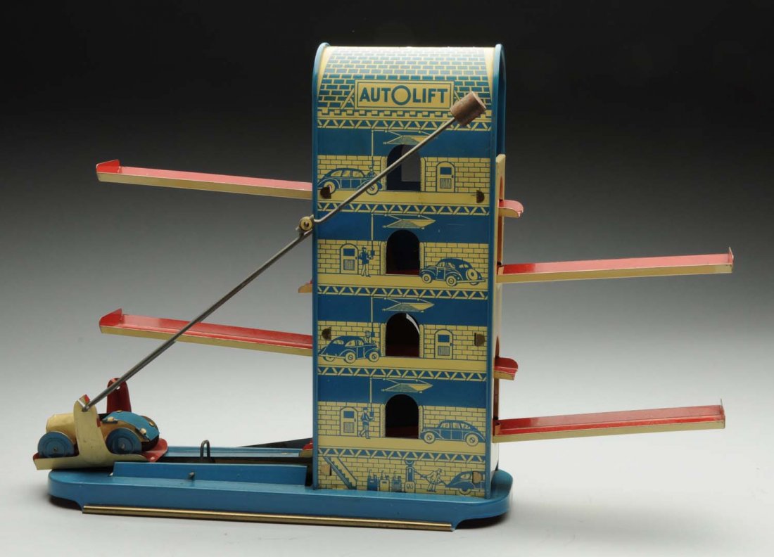 Wolverine Tin Litho Wind-Up Auto-lift Toy.: Comes in original box marked "No. 19 Mechanical auto lift by Wolverine". Box is missing two inside flaps and has one end flap detached but present. Toy itself has very little wear and has original aut