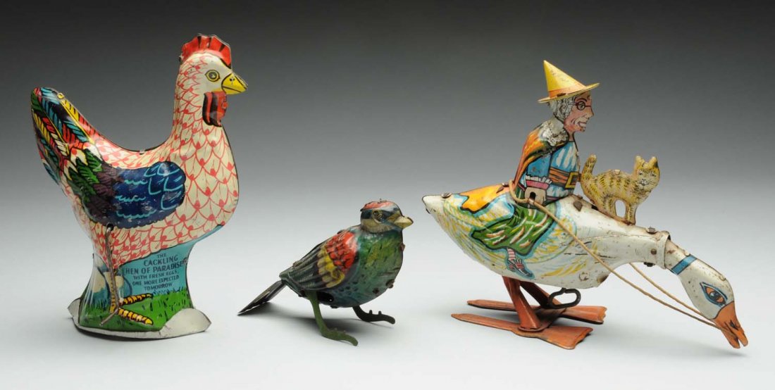 Lot of 3: Tin Litho Animal Toys.: This lot includes: a Marx mother of goose riding a goose with a cat on top of the goose, a wind - up bird and a crank cackling hen of paradise, missing its wood eggs. Various conditions. Condition (Ve