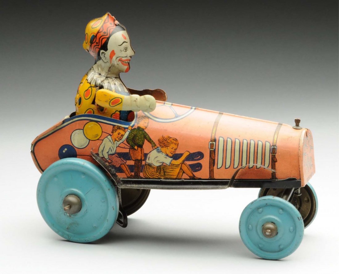 Unique Art Tin Litho Wind-Up Clown Crazy Car.: Includes original clown driver. Nice lithography of children on the sides of the car. Some wear and scratching to the wheels. Condition (Very Good - Excellent). Size 8" L.