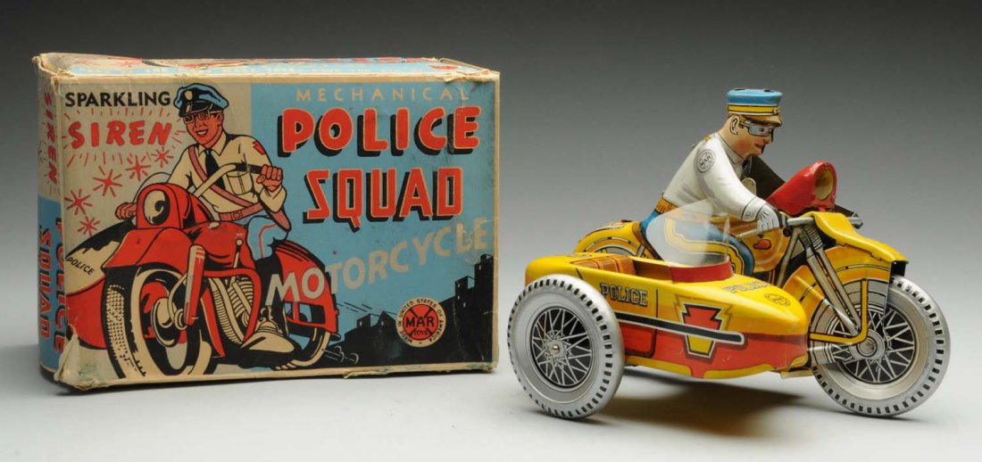 Marx Mechanical Police Squad Motorcycle.: Includes very colorful original box. Box has some creasing and tearing. Later version. Toy itself has minor scratching and wear. Siren works. Plastic windshield replaced. Condition (Very Good - Excell