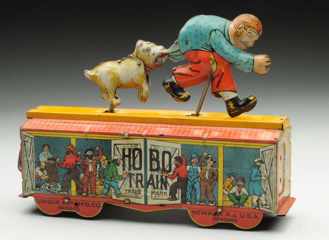 Unique Art Tin Litho Wind-Up Hobo Train Toy.: Nice depiction of hobo on top of train being bitten in the rear by a dog when in operation. Tin litho hobos on both sides with some fading to one side. Toy was probably in a window at one time. Condit