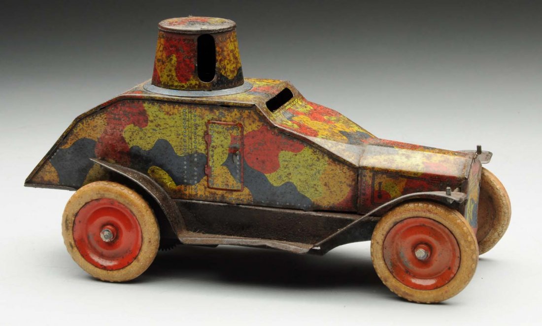 Japanese Wind-Up Pre-War Armored Car.: Armored car has white rubber tires and is marked "Made in Japan" on rear. It has an anchor mark and is probably made by Hadson. There is some pitting and oxidation throughout. Condition (Good - Very G