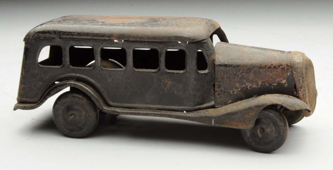 Japanese Bonnet-Type Bus.: Marked "Balloon Cord" on tin litho tires and "800" on one side. Rough condition on one side and may have possibly had some smoke damage. Condition (Good). Size 7" L.