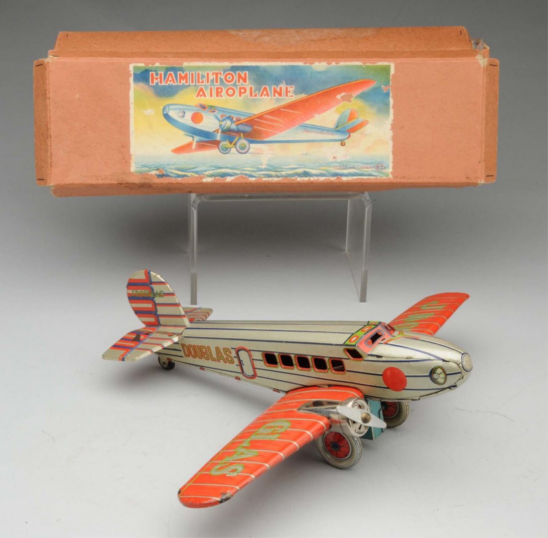 Beautiful Pre - War Japanese Hamilton Airoplane.: This tin litho wind - up airoplane has beautiful lithography marked "JDOU" "GALS" on wings. Also marked "Douglas" on rear and "J. Douglas" on both sides of tail fin. Has a trade mark and "Made in Japa