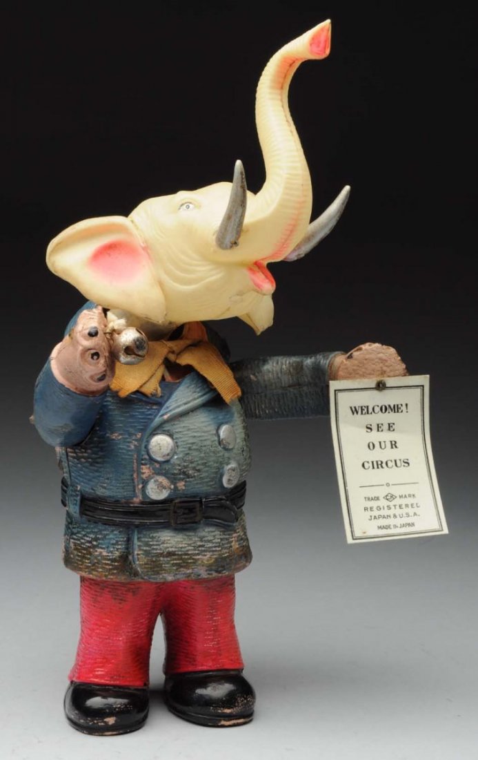 Pre- War Celluloid Japanese Wind Up Elephant Toy: Nice action toy; when in operation arms go up and down as does head. Has original Welcome to the circus sign in left hand. Made by CK Japan. Bell in right hand. Look to be no cracks or breaks, but doe