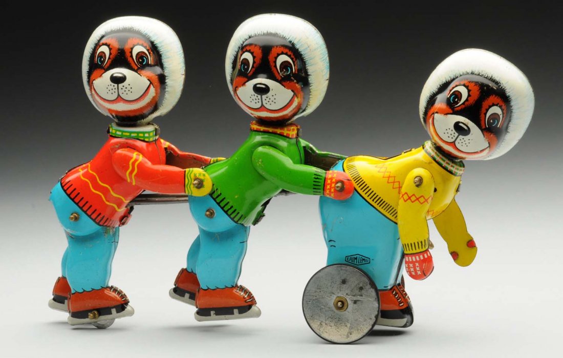 Tin Litho Wind-Up Skating Bears Toy.: Nice action toy. Legs and arms of bears move. Looks to be scarcer Spanish version marked "Y Film Elmez" on pants of the front skater. Missing rubber edges on both wheels. Some scratching throughout. C