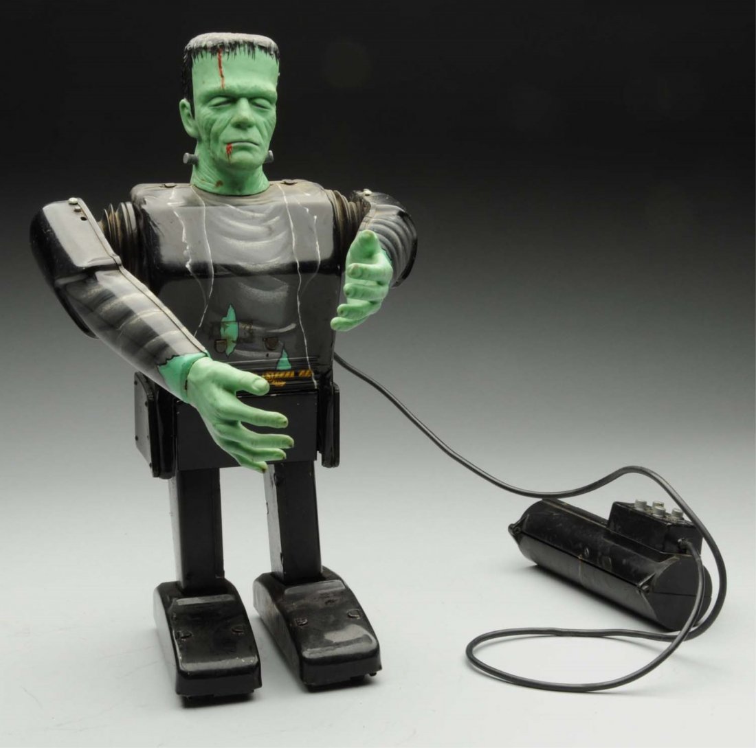 Marx Tin Litho Battery Operated Frankenstein Toy.: Operated by remote control. Body and legs are tin. Hands and head are vinyl. Nice lithography, with a moderate amount of scratching. Does not work. Condition (Very Good). Size 13" T.