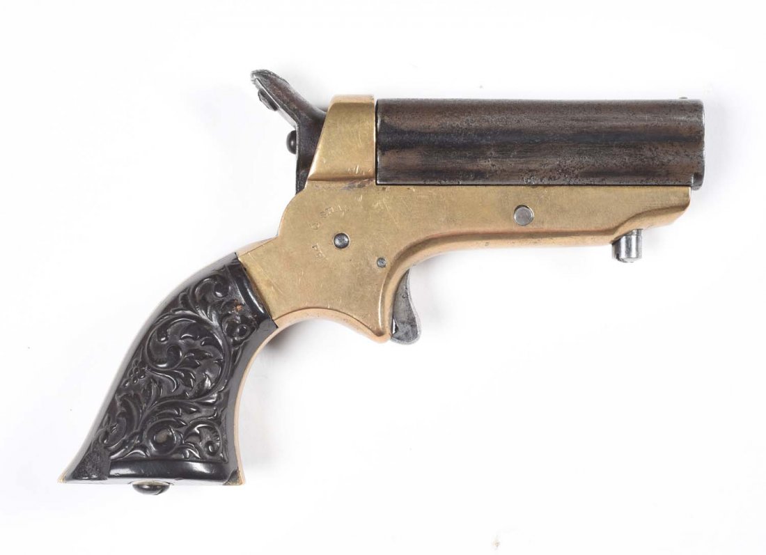 Sharps Breach Loading 4 Barrel Pepperbox Pistol.: Serial No. 91139. Offered is a Model 1 in .22 rimfire caliber, silver plated brass frame, gutta percha carved grips, spur trigger, rotating firing pin (working). Barrels are basically a blue-brown pat