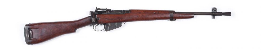 British Enfield No. 5 (Jungle Carbine).**: Caliber .303 British. Dated 5/46. Standard features includes 19" barrel with flash suppressor (20-1/2" total). All metal is a blue-brown patina. Very good stock with A.L. carved in the side, and name 