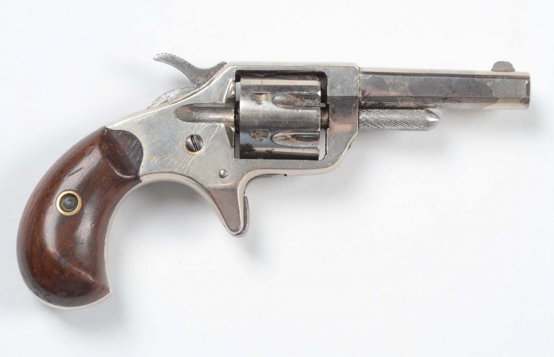 Colt New Line (Etched) .22 Revolver.: Serial No. 15094. Fine diminutive revolver manufactured from 1873 to 1877. This is a standard first model with the short flute seven shot cylinder and a 2-1/4" octagon barrel. Gun retains approximatel