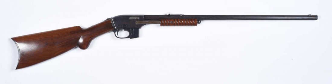 Savage Model 1914 Slide Action Rifle.**: Serial No. 90805. This pump action .22 caliber rifle was manufactured from 1914 to 1926. Features include a 24" full octagon barrel, half magazine, plain pistol grip stock, rifle butt, take down, maga