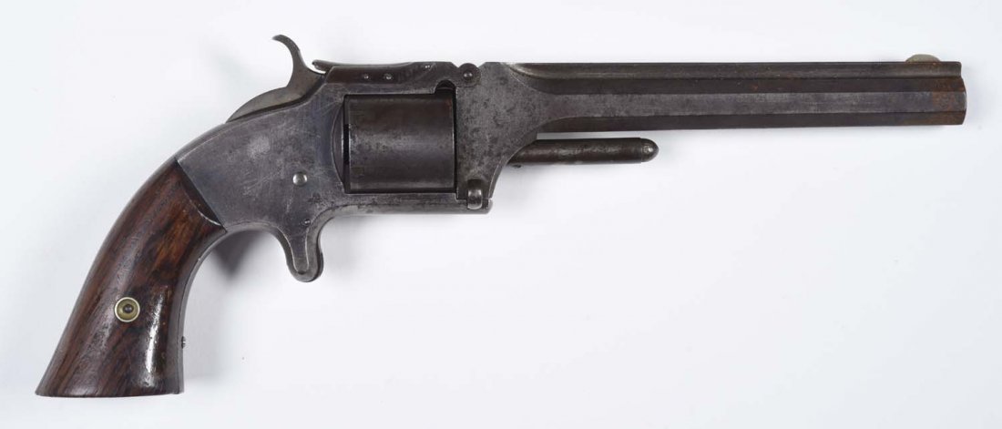 S&W Model No. 2 Old Model Revolver.: Serial No. 66823. .32 rimfire, six shot, non fluted cylinder, 6" octagon barrel, single action, spur trigger, blued finish, walnut grips. Metal is all grey-brown smooth patina. Loose hinge. Excellent 