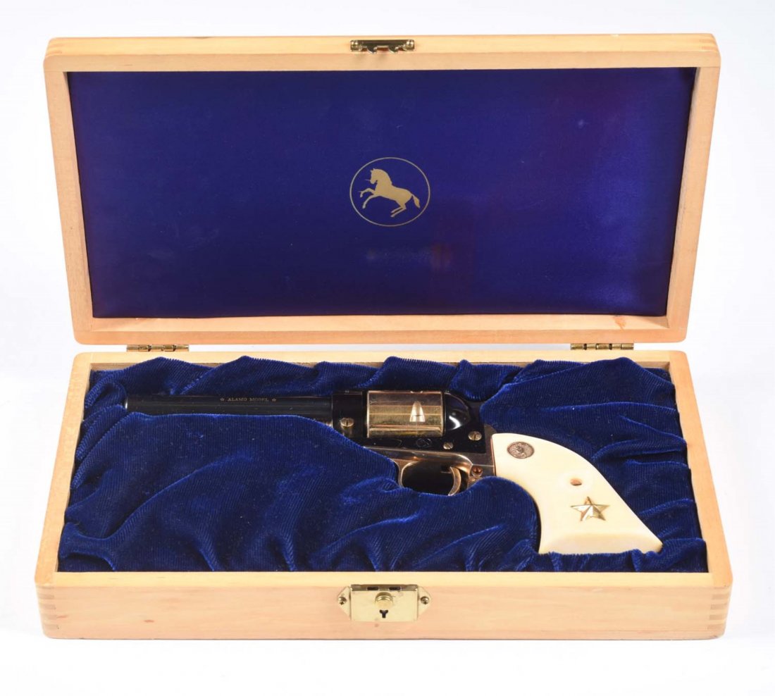 Colt .22 Commemorative Alamo Revolver.**: Serial No. 4212A22. This is a Colt Scout Alamo single action .22 revolver. Gun is new in original Colt display case. Gun has 4-1/2” barrel and has gold plated cylinder, hammer, back strap, trigger g