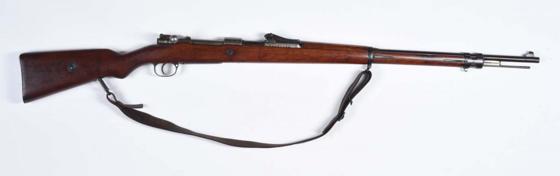 WWI Gew. 98 Military Bolt Action Rifle.**: Matching numbers on barrel, receiver, and floorplate. Imperial inspector marks on bolt. Receiver in the white and stamped "Spandau 1916". Standard roller coaster rear sight. Metal retains virtually al