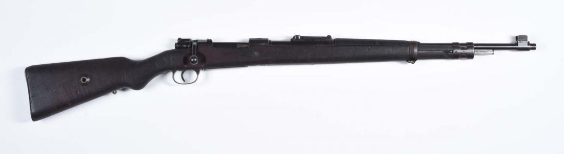 Nazi Issue Portuguese 937-A Mauser Short Rifle.**: Serial No. D829. Has matching barrel, receiver, bolt, floorplate, nose cap, rear barrel band, and safety. The German Waffenamt is found stamped the front sight ears, both barrel bands, barrel, and rec