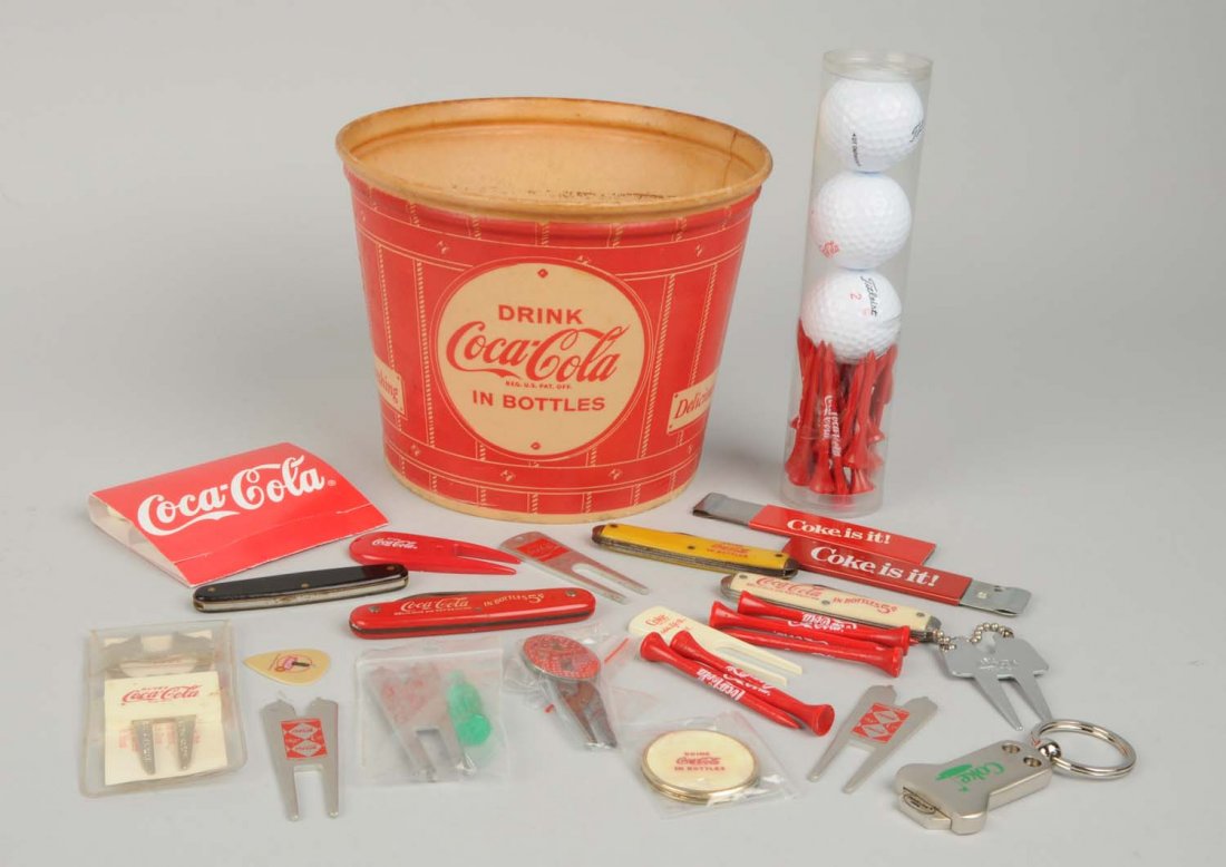 Lot of Coca - Cola Advertising Items.: This lot includes a popcorn bucket, a set of golf balls and tees, several pocket knives and other items. Condition (Very Good - Excellent). Size Largest : 8" L.