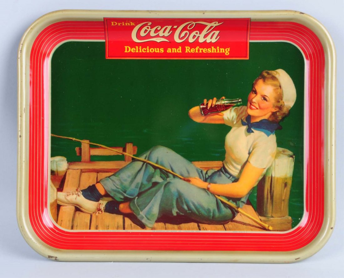 1940 Coca - Cola Serving Tray.: This tray has a few small nicks to the rim only. A few small nearly unnoticeable stains near the girl's shoulder. Condition (Very Good Plus). Size 13" L.