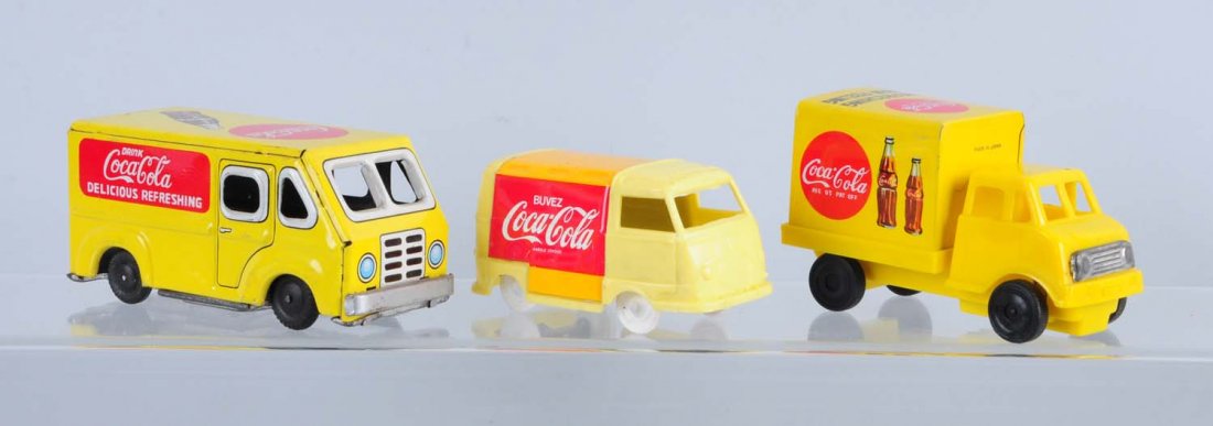 Lot of 4: Small Coca - Cola Toy Trucks.: This lot includes a small friction Coca - cola van and two plastic trucks. Condition (Very Good Plus). Size Largest: 4" L.