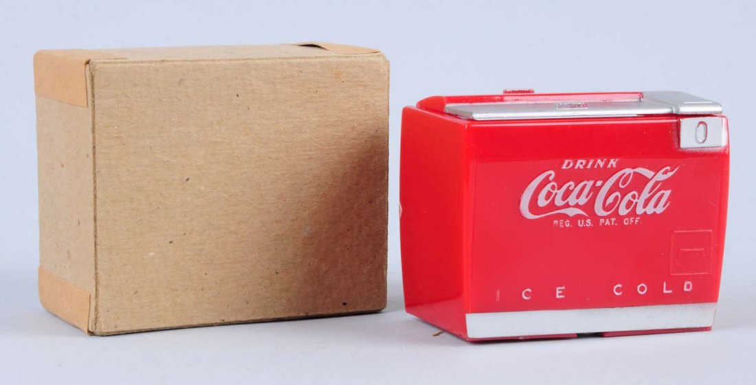 1950s Coca-Cola Miniature Cooler.: This example opens to reveal cooler space allocation illustrations. The original box is also included. Condition (Excellent Plus). Size 3" L.