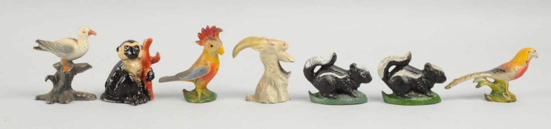 Lot of 7: Cast Iron Assorted Bottle Openers.: Includes – Seagull, Monkey, Cockatoo, Billy Goat, Golden Pheasant, and two Skunks. Condition (Excellent). Size Largest: 4 - 1/4" L.