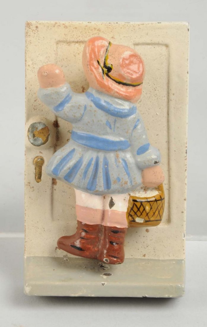 Cast Iron Girl Knocking Doorknocker.: Made by Hubley, catalog #143. Grace Raynor designer, “1921”. Condition (Excellent). Size 4" L.