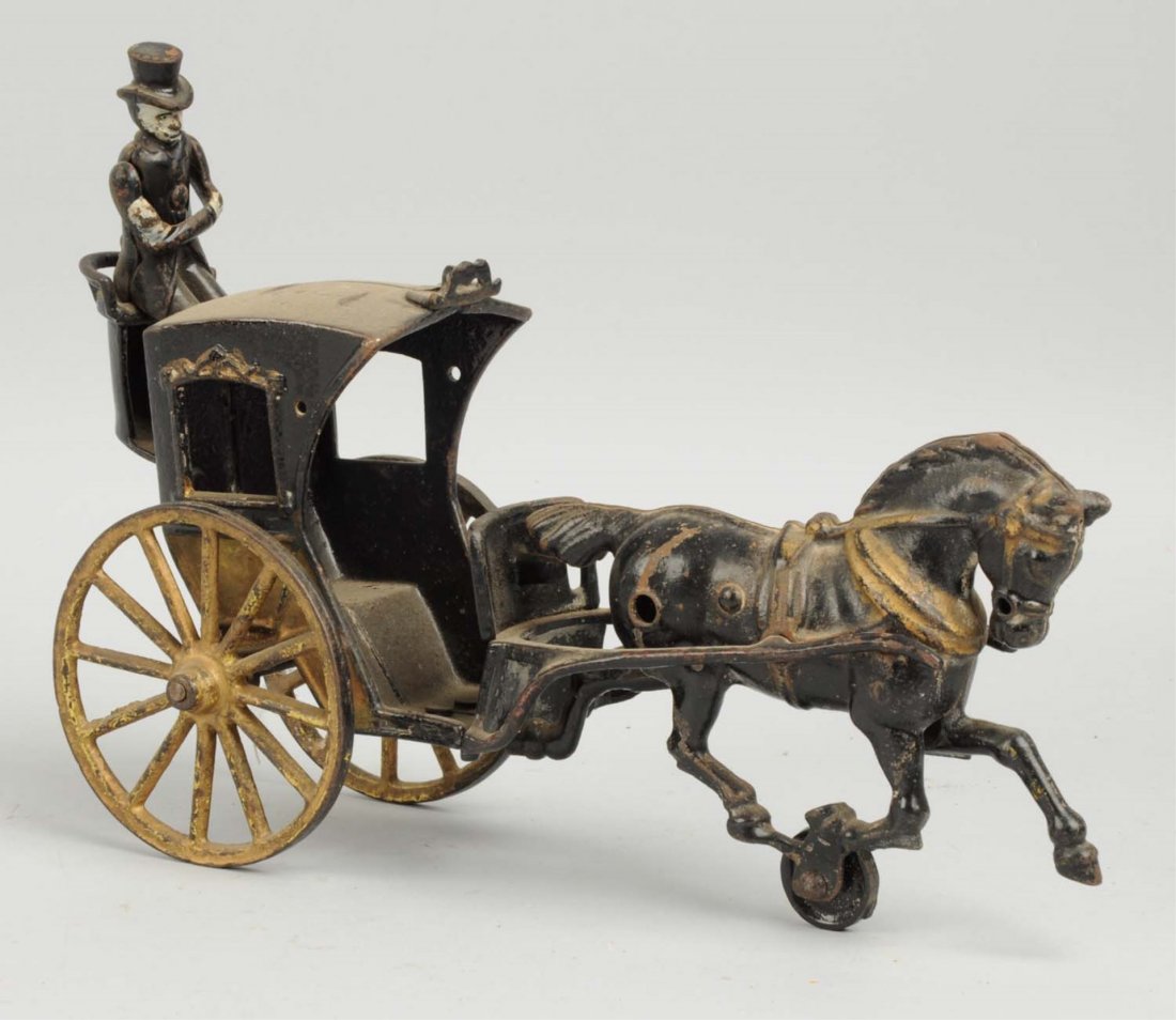 Cast Iron Horse Drawn Hanson Cab.: Drawn by one horse. Original driver in rear, no passenger. Original horse but maybe not to this toy. Has some repainting. Condition (Very Good). Size 11" L.