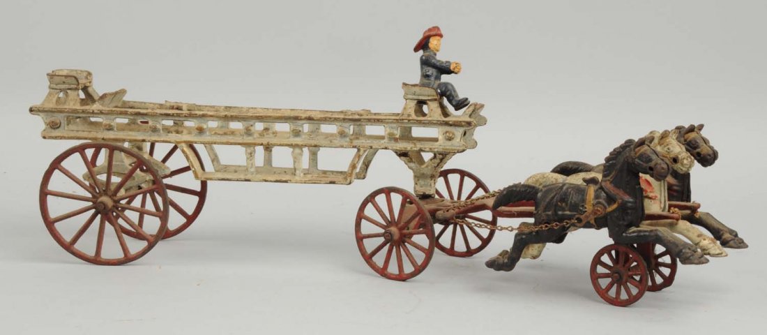 Cast Iron Horse Drawn Fire Ladder Wagon.: American made. Pulled by three horses. Has one original fireman in the front, missing rear fireman, hangers and ladders. Some paint loss throughout. Condition (Very Good). Size 18" L.