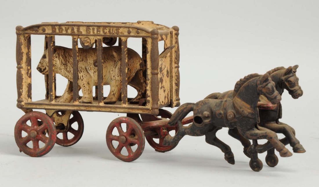 Cast Iron Small Royal Circus Wagon Horse Draw.: Has original polar bear inside. Marked "Royal Circus" on sides of cage. Missing driver, moderate to heavy paint loss. Condition (Good - Very Good). Size 9" L