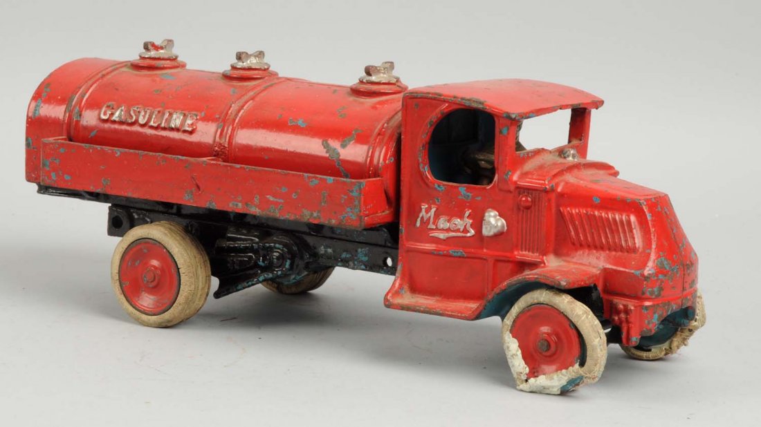 Cast Iron Arcade Mack Gasoline Truck.: Embossed "Gasoline" on rear and "Mack" on both sides of door. All cast iron version. White rubber tires. Dual rear tires. White tires in front are distorted and melted. Originally was blue, truck has