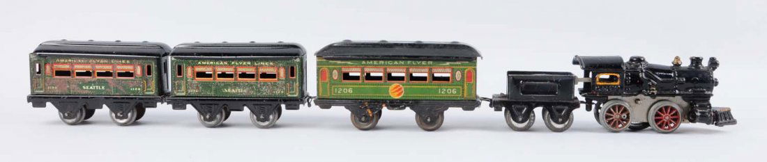 5-Piece Wind-Up American Flyer Train Set.: American Flyer No. 10 steam locomotive O-4-O with no key, missing side rod, nice paint on the boiler. Marx Joy Line Shorty type tender is complete and all original with some scratches and paint chips.