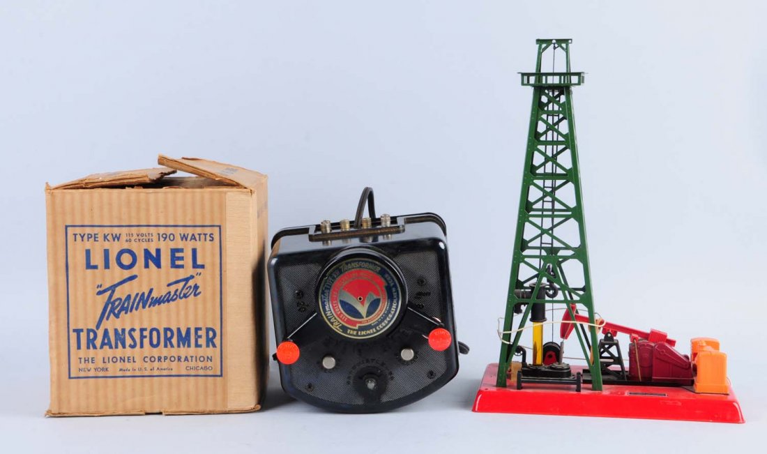 164 Lumber Loader OB, 455 Oil Derrick.: Lionel No. 455 oil derrick needs signs, oil barrels, and an off switch. What is here is in excellent condition. No. 164 lumber loader is missing control button but is otherwise complete and all origin