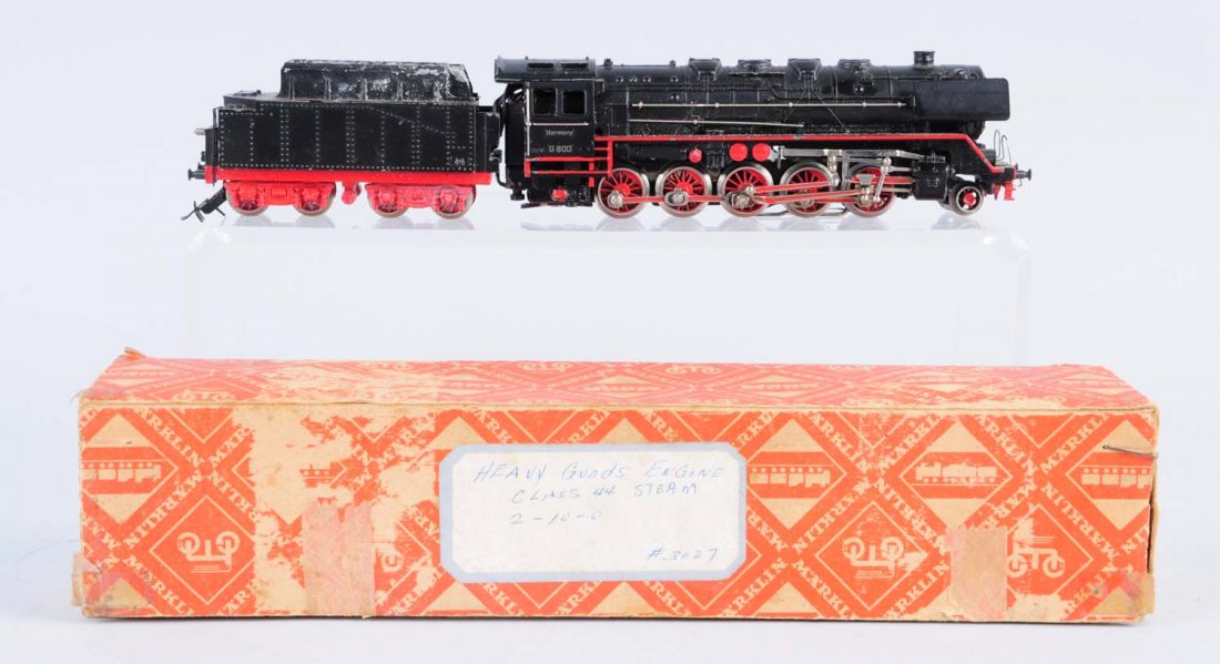 Ho Locomotive with a Tender Car.: Includes original box which is made of wood and cardboard. The engine and tender car appear to be complete with lots of details. Box is missing a flap and has a paper tear on the other side along with