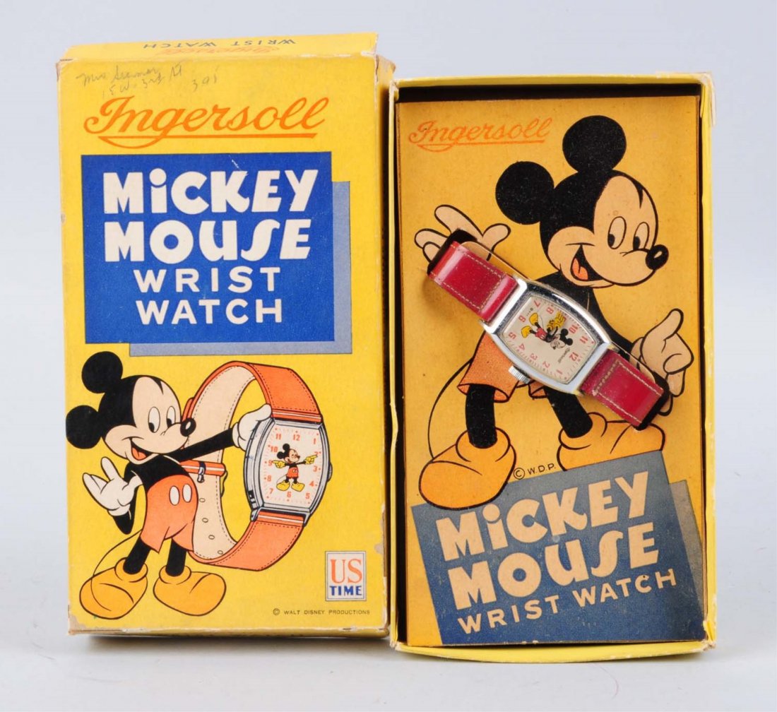 Mickey Mouse Wrist Watch.: Comes with original box and insert, has small paper pulls and the corners detached but present. Made by United States Time Corp. The watch depicts a Mickey Mouse inside the face of the watch and his h