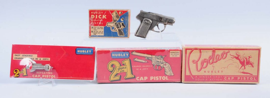 Lot of 5: Misc. Cap Gun and Cap Gun Boxes.: There is a Hubley Dick in the original box, a Hubley rodeo box only, and a Hubley two guns in one box plus insert with barrel. Condition (Very Good). Size Largest: 8 1/2" x 3 3/8"