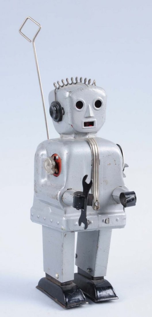 Japanese Made Radar Robot.: It the version with the silver color on it. Has tin scratches throughout. Includes wrench in hand. Has start and stop turning lever on one of its sides. Battery compartment is very clean. Also include