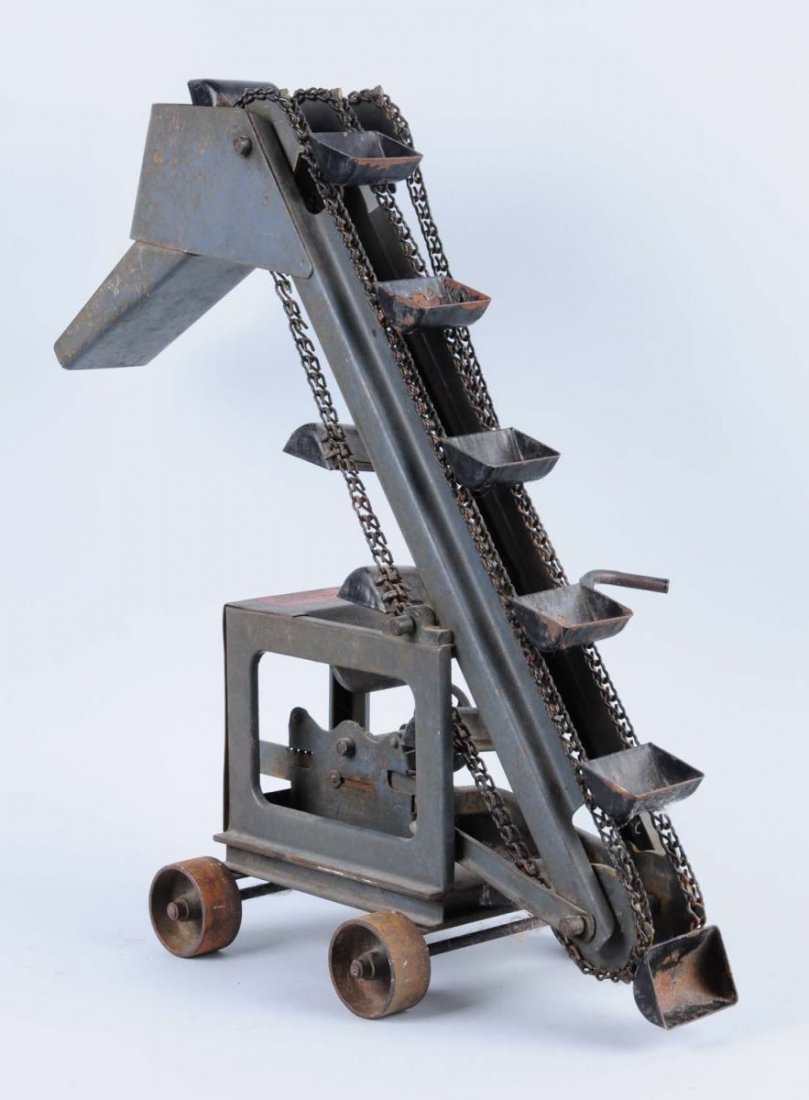 Buddy L. Pressed Steel Mobile Quarry Excavator.: Significant paint chips and scratches throughout. Some of the buckets have paint chips and oxidation. Appears one of the buckets is missing from the metal belt. In working condition. Condition (Good -