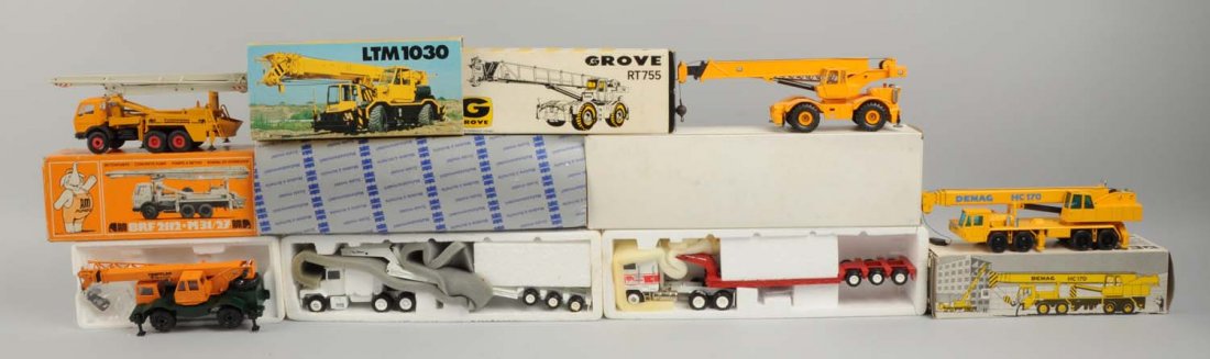 Lot of 5: Construction Vehicles.: Comes with original boxes which includes original inserts. Includes two mobile crane, a concrete pump, a telescopic truck crane, two flat tractor trailers. Toys do not have any visible scratches or pa