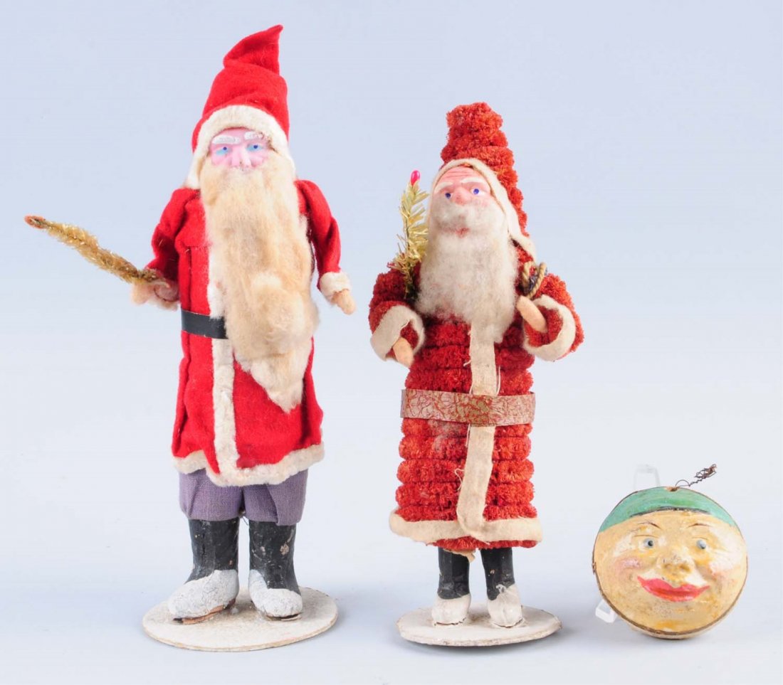 Lot of 3: Christmas Items.: This lot includes two Santa figures and a two faced paper mache ornament. Condition (Very Good Plus). Size Largest : 9" L.