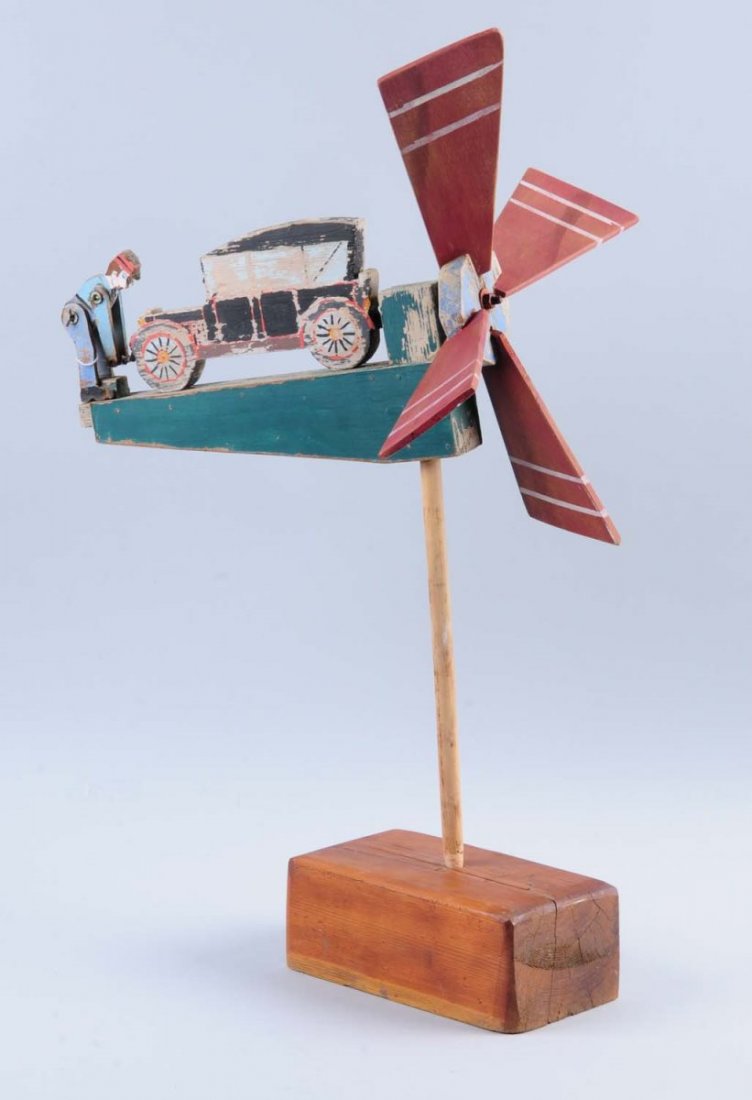 Wooden Whirlygig.: Of man cranking car, works well. Paint loss from wear. Condition (Excellent). Size 28" L.