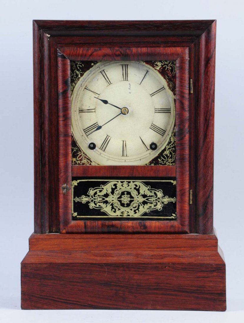 Terry Cottage Mantle Clock.: Time and strike clock. Has pendulum, but no key. Condition (Excellent). Size 16" T.